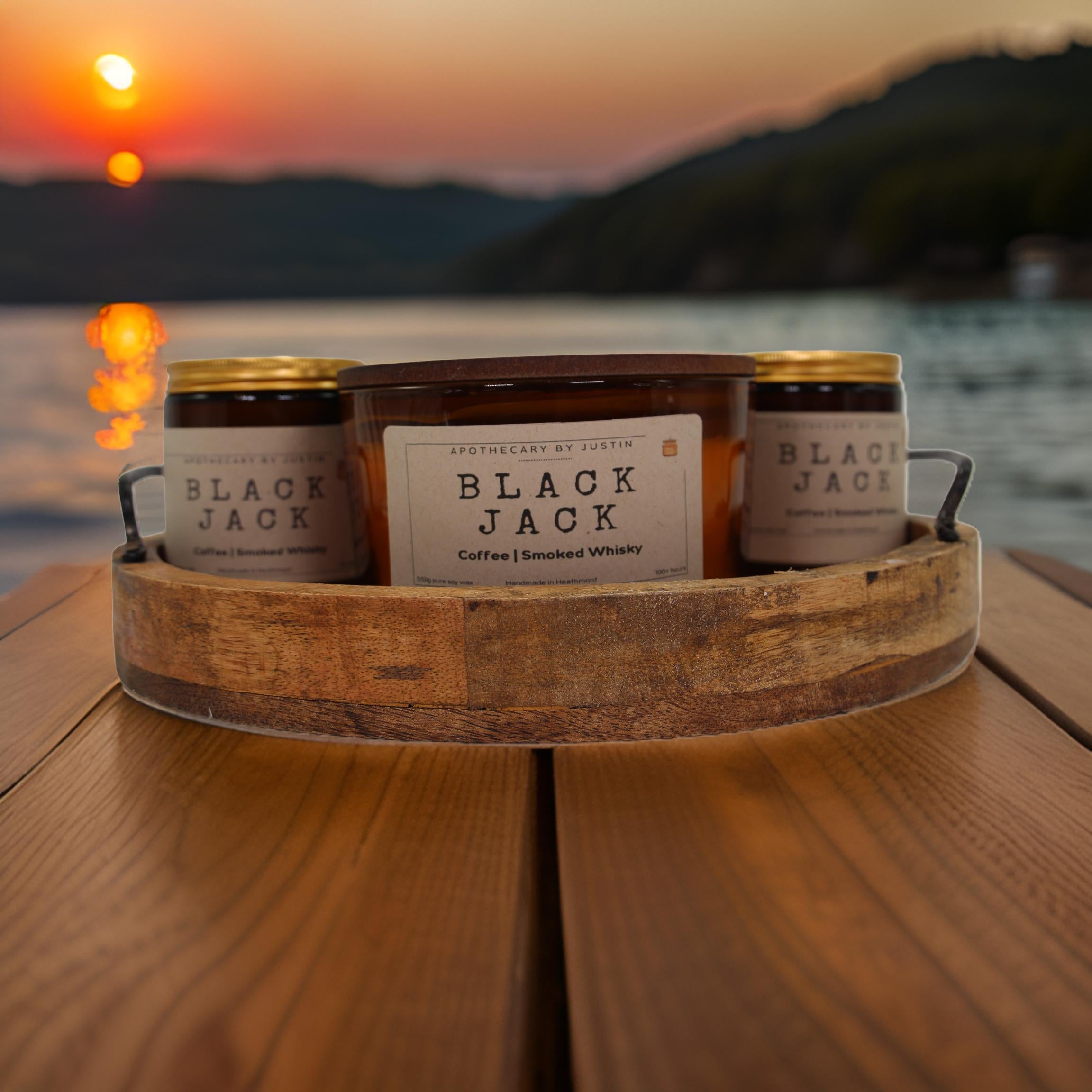 Unique candle gifts free delivery featuring artisanal scents set against a sunset over the water