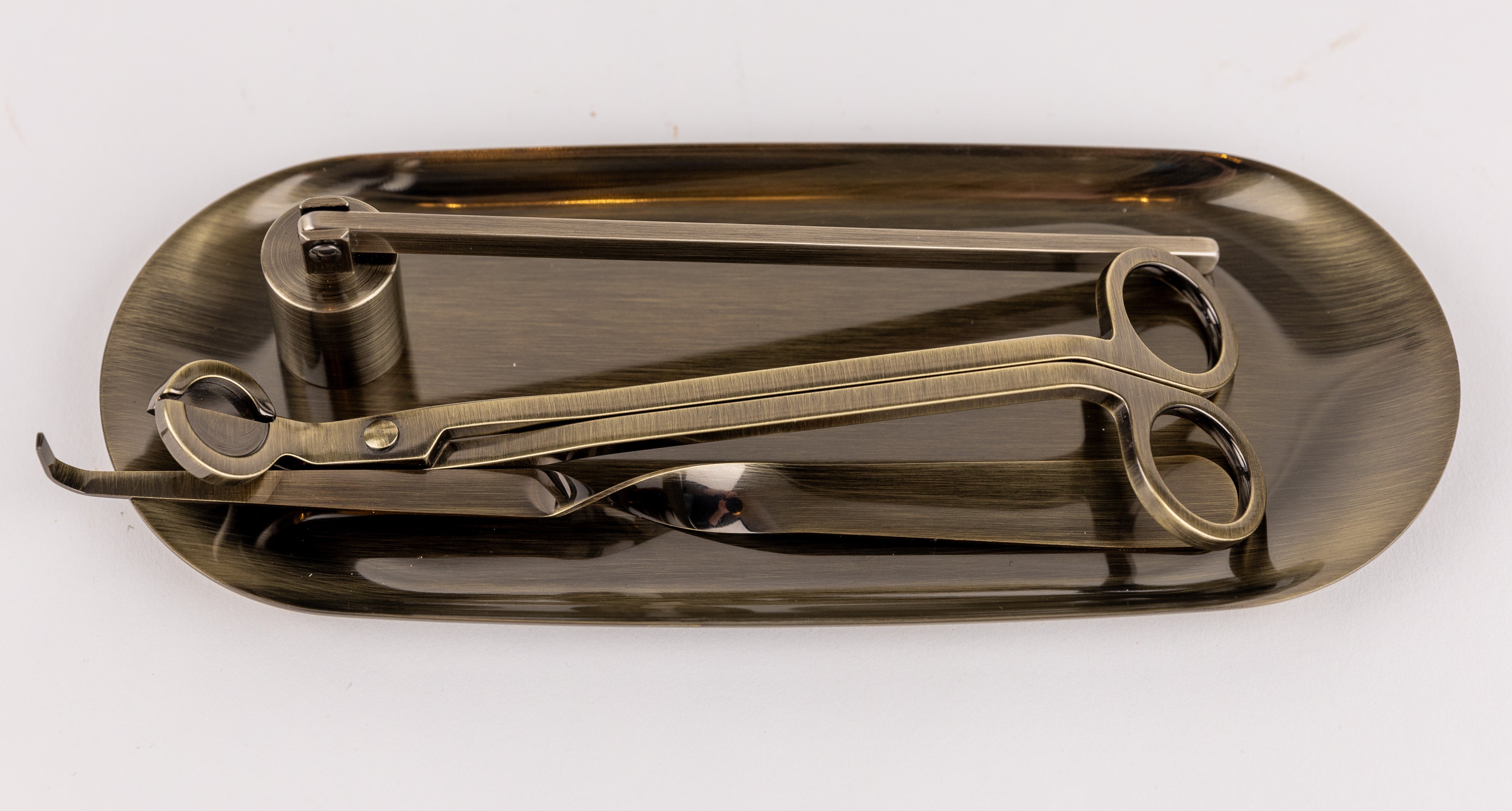 Candle care essentials Australia set featuring candle wick trimmer and snuffer on a decorative tray