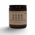 Star Dust Additive-Free Candles in amber jar with scents of apple, melon, jasmine, vanilla, and musk