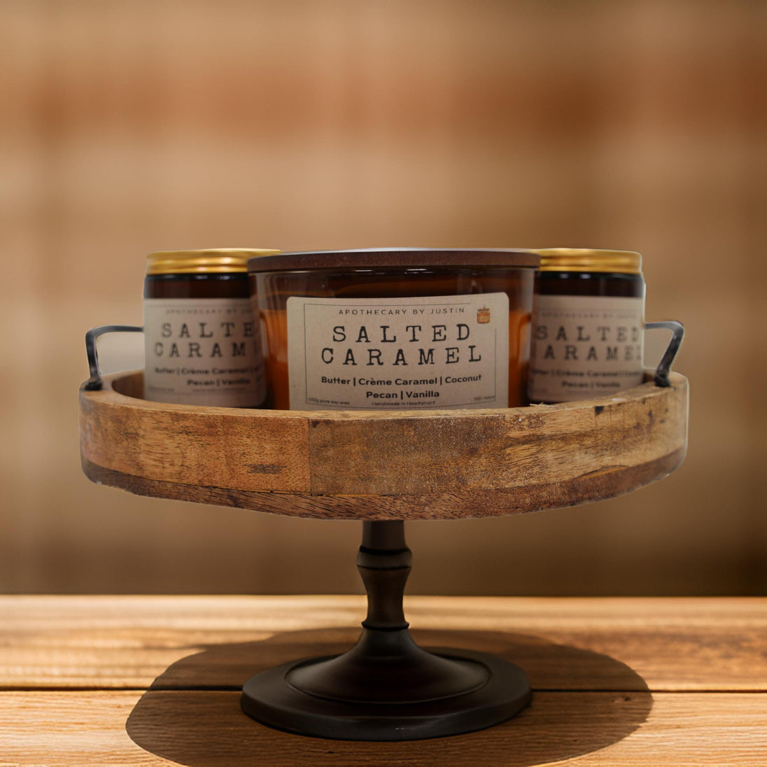 Set of three Salted Caramel Additive-Free Soy Candles in a decorative wooden display