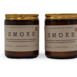 Two My Store additive-free soy wax candles in amber jars with golden lids, featuring smoky scents