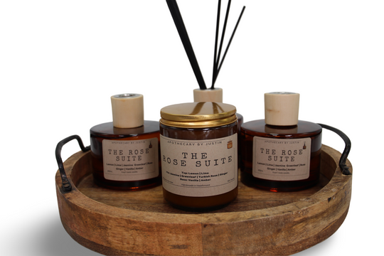 Australian rose diffuser set with candle and essential oils on a decorative wooden tray
