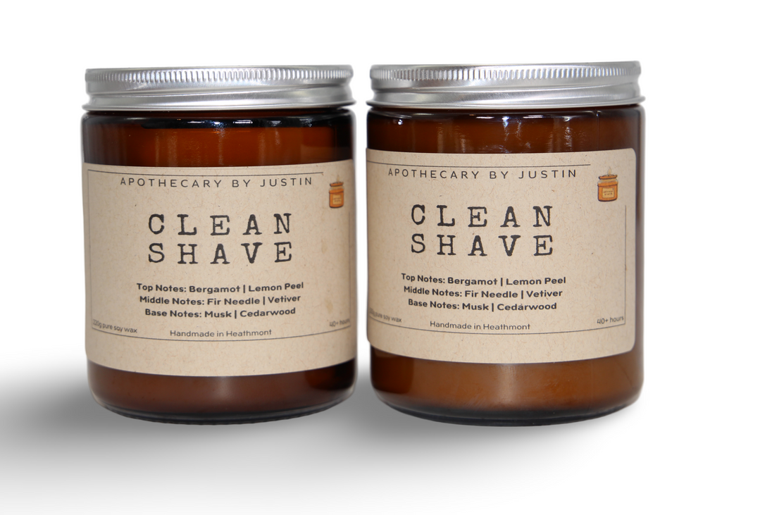 Bergamot lemon peel candle in amber jar with a clean shave label for fresh home fragrance