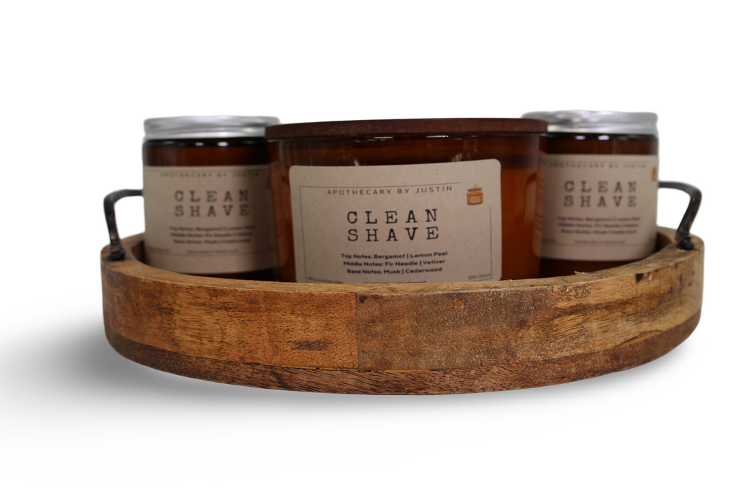 My Store bergamot lemon peel candle in a rustic wooden tray with other handmade candles