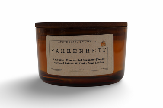 My Store Dior Fahrenheit fragrance candle in an amber glass jar with a blend of calming scents