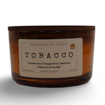 Hand-poured aroma candle in an amber jar with Tobacco, Cardamom, and Jasmine scents for a soothing ambiance