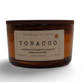 Hand-poured aroma candle in an amber jar with Tobacco, Cardamom, and Jasmine scents for a soothing ambiance