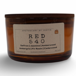 My Store hand-poured scented candle in amber glass with saffron, jasmine, and amberwood fragrance