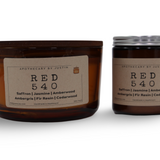 Hand-poured scented candle set featuring saffron, jasmine, and amberwood scents in amber jars