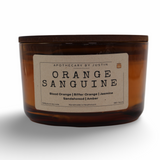 Orange Sanguine candle purchase featuring blood orange, jasmine, and sandalwood scent in a stylish jar