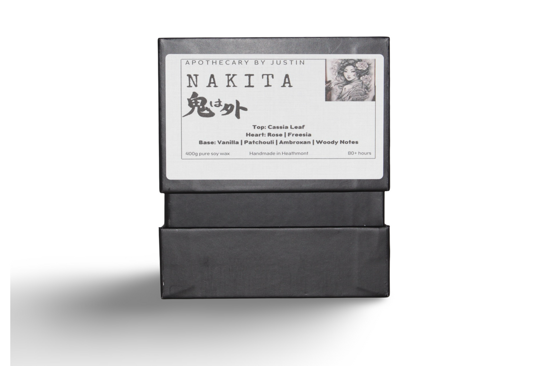 Prosperous scented candle in elegant packaging with notes of cassia leaf, vanilla, and patchouli