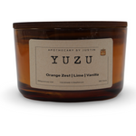 Yuzu scented candle in amber glass, featuring orange zest, lime, and vanilla, perfect for Mother's Day