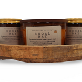 Shoal Bay aromatherapy candle trio displayed in a wooden tray with natural scents