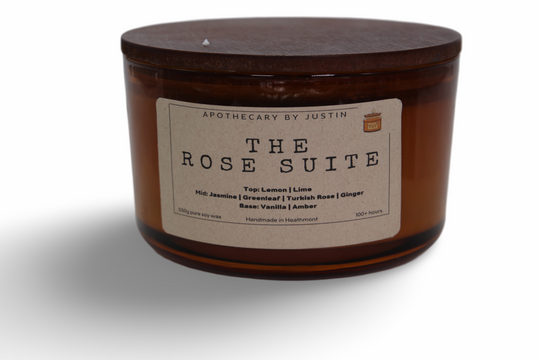 The Rose Suite Candle by Apothecary by Justin, a strong hot-throw candle with lemon, jasmine, and vanilla scents