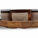 Strong hot-throw candles in Tropical Delight scent featuring lychee, peach, coconut, and vanilla