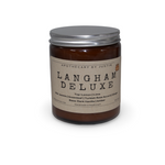 Langham Deluxe candle in a brown jar with a strong hot-throw woodsy candle scent