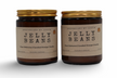 Two unique home fragrance candles in amber jars featuring Plum, Satsuma, and Candied Orange scents
