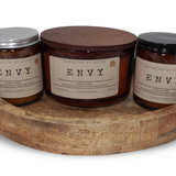 Vegan soy candles hand-poured displayed on a wooden tray, labeled 'Envy' from My Store