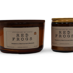 Vegan soy candle raspberry in amber glass jar with elegant label design for a cozy ambiance