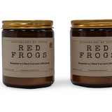 Vegan soy candle raspberry in amber jar with gold lid, featuring raspberry, red currant, and rhubarb scents
