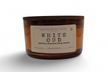 Strong hot-throw amber candle in a glass container with a wooden lid and aroma notes of saffron and jasmine
